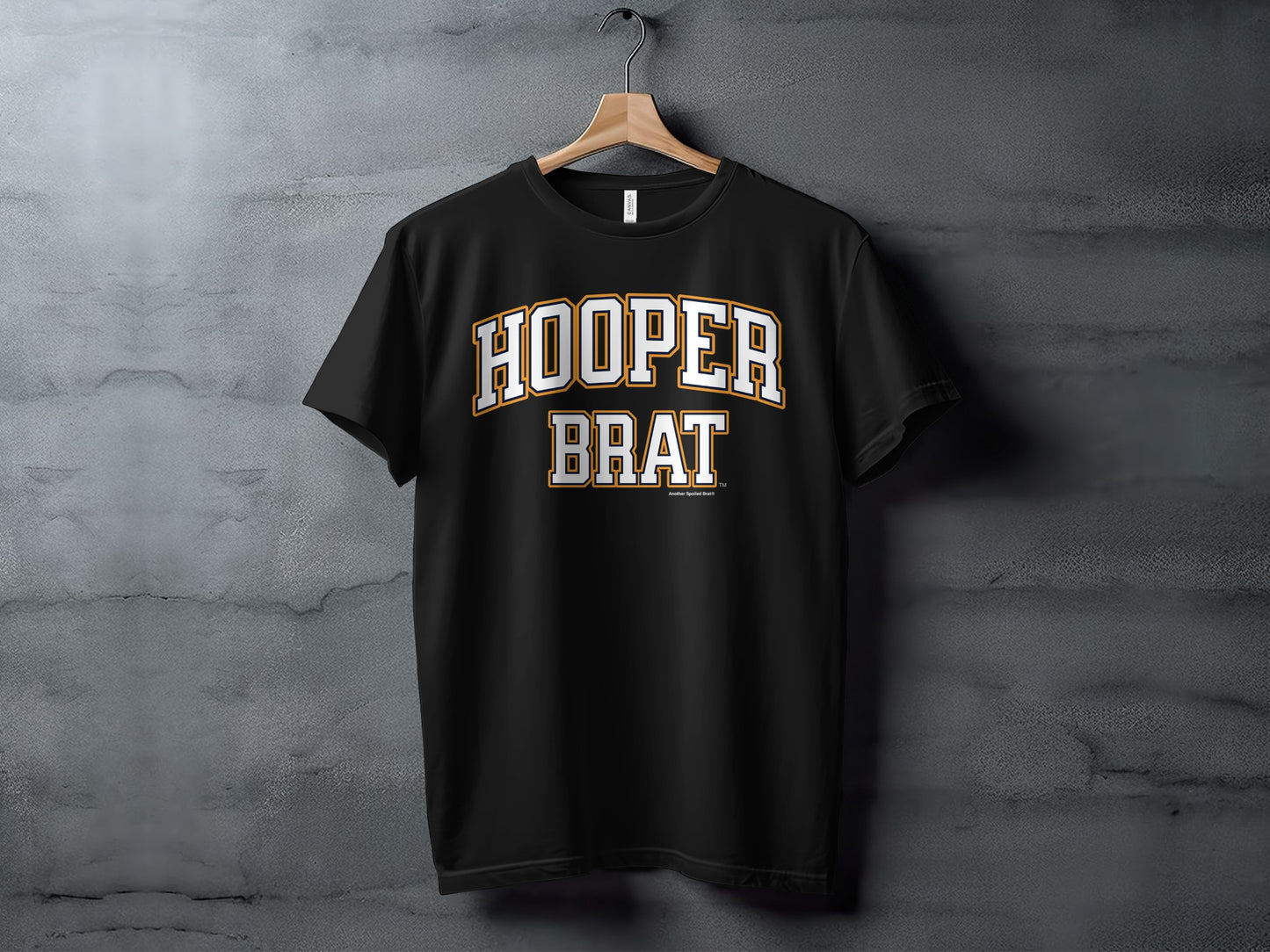 Black t-shirt with white and gold "HOOPER BRAT" text design.