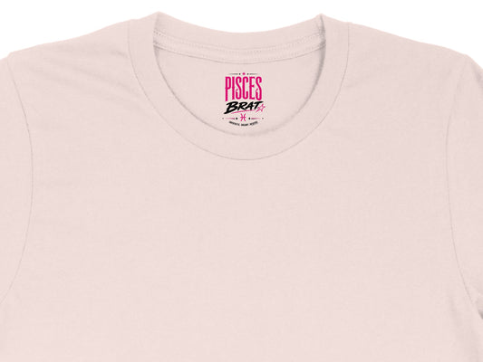 Pink t-shirt collar with "PISCES BRAT" and Pisces symbol.