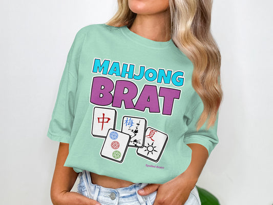 T-shirt with "Mahjong Brat" text and four Mahjong tiles.