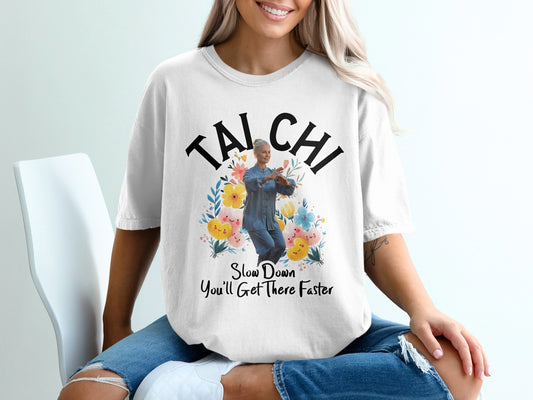 White t-shirt with "TAI CHI" and floral design.