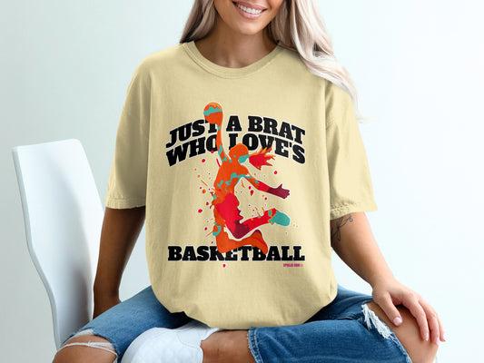 Cream t-shirt with colorful basketball player graphic and text.