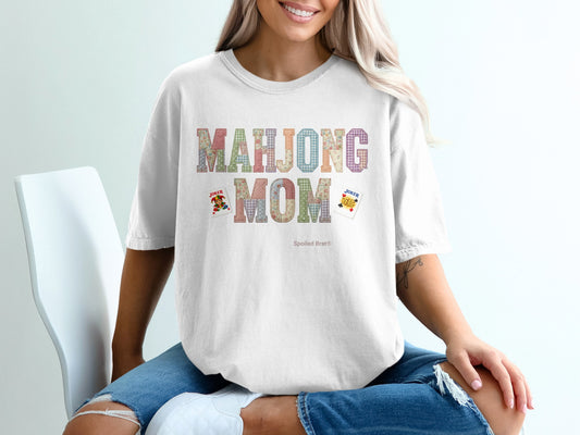 T-shirt with "Mahjong Mom" text and playing card graphics.