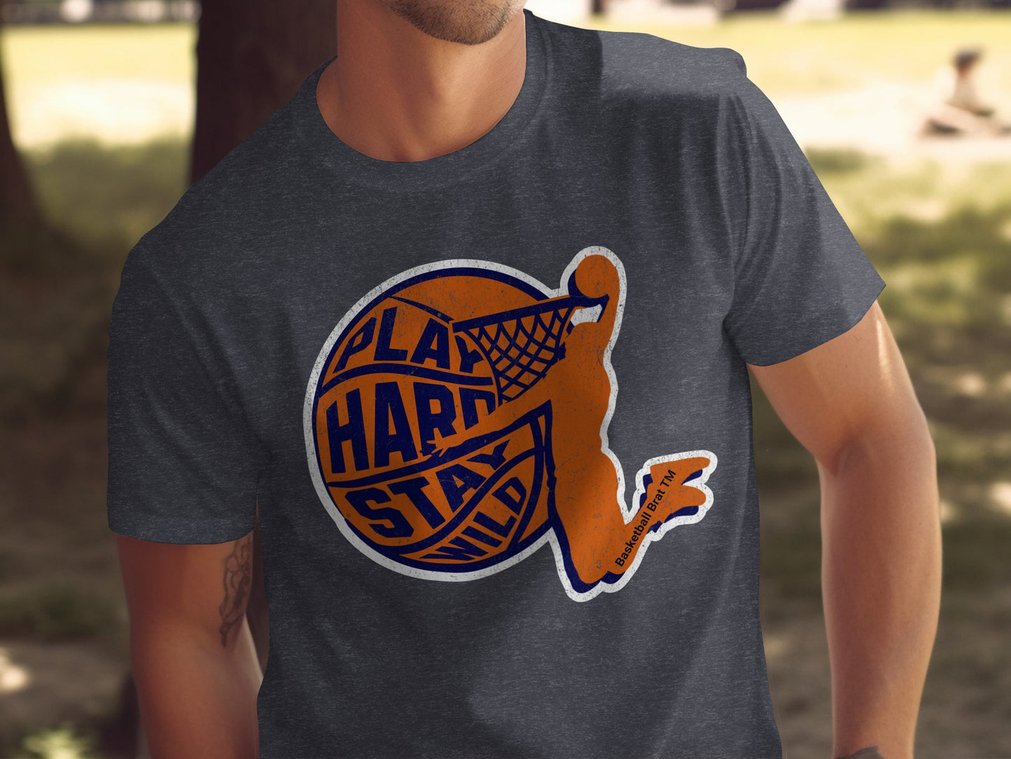 Dark gray t-shirt with a basketball player dunking, text says "Play Hard Stay Wild".