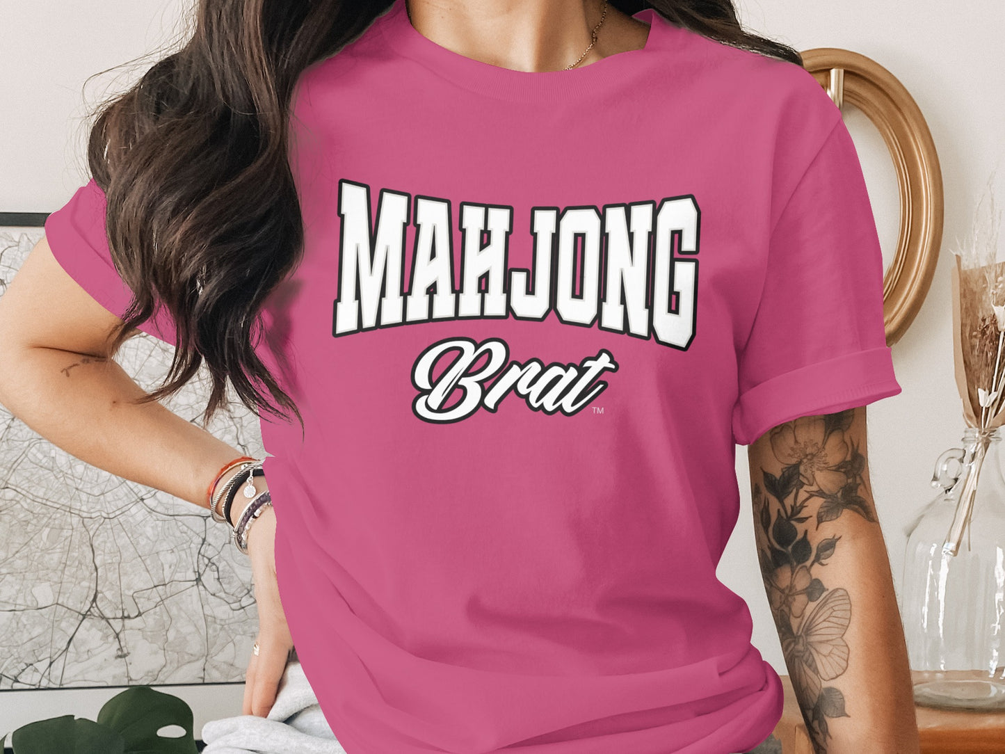Pink t-shirt with white text "MAHJONG Brat"