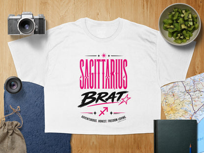 White t-shirt with "SAGITTARIUS BRAT" and zodiac symbols.