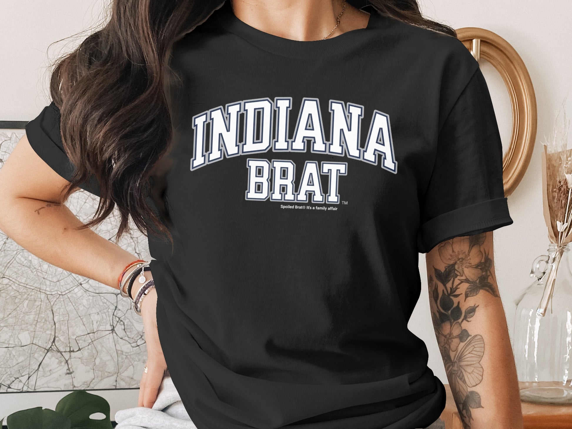 Black t-shirt with "INDIANA BRAT" and "Spoiled Brat: It's a family affair."