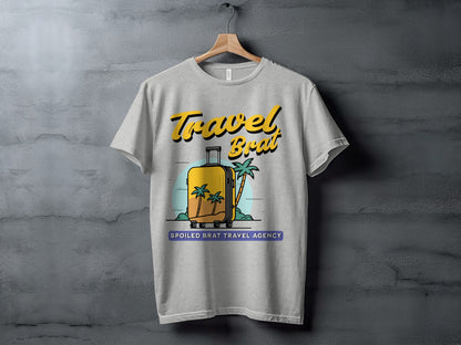 Grey t-shirt with "Travel Brat" and a yellow suitcase with palm trees and "Spoiled Brat Travel Agency".