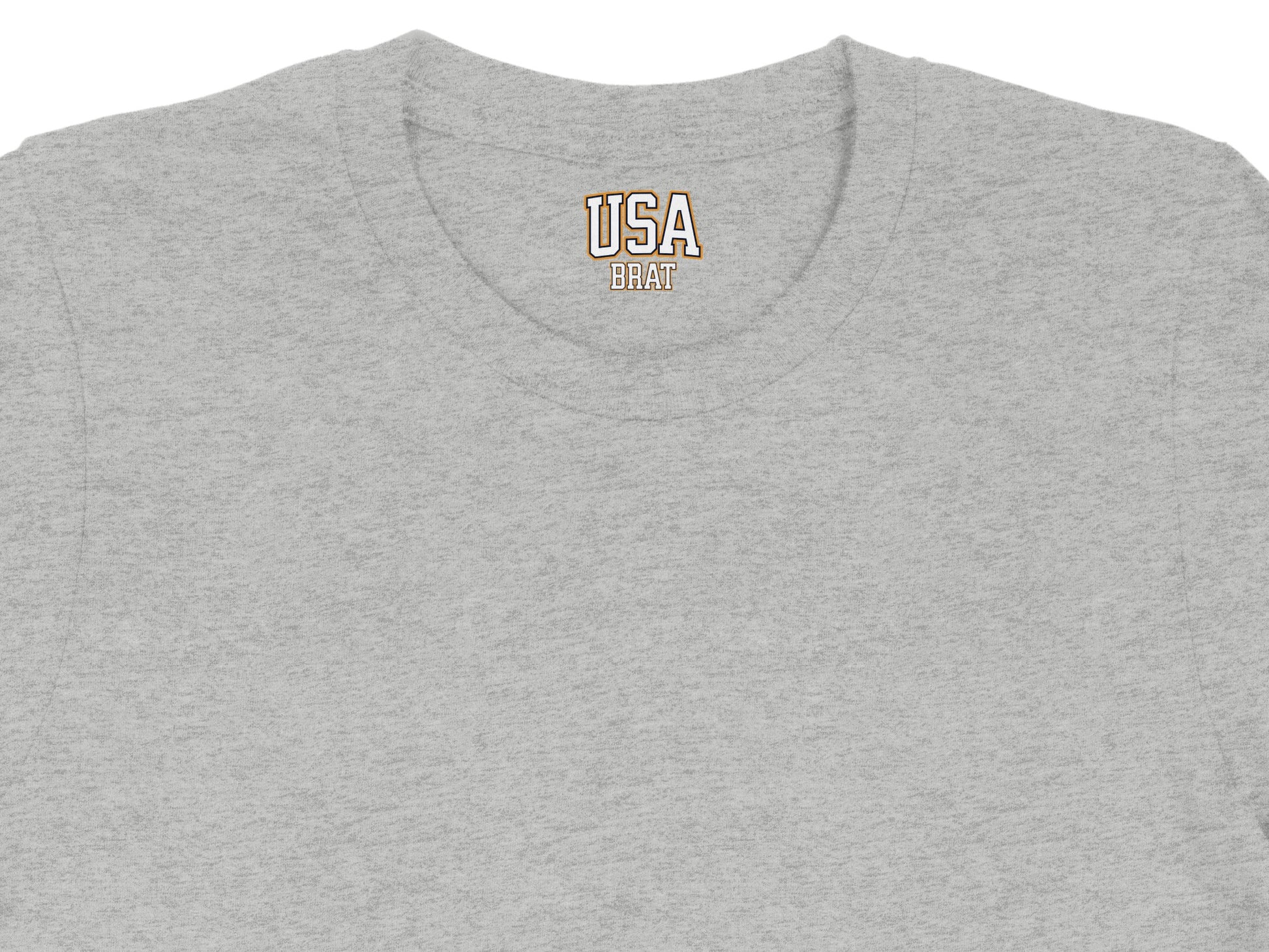 Grey t-shirt collar with embroidered USA BRAT text in orange and gold.