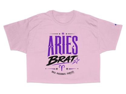 Pink crop t-shirt with "Aries Brat" text and zodiac symbol.