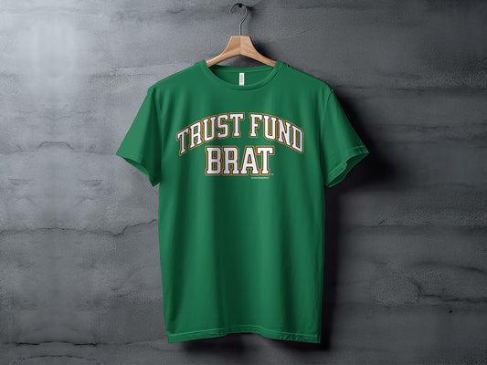Green t-shirt with "TRUST FUND BRAT" text in arched white and gold letters.