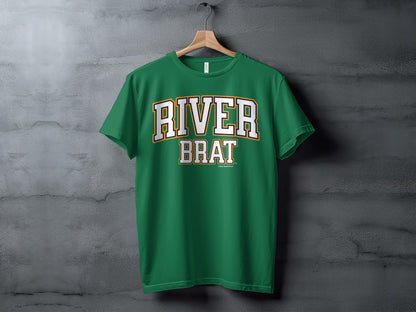 Green t-shirt with white and yellow "RIVER BRAT" text, hanging on a hanger.