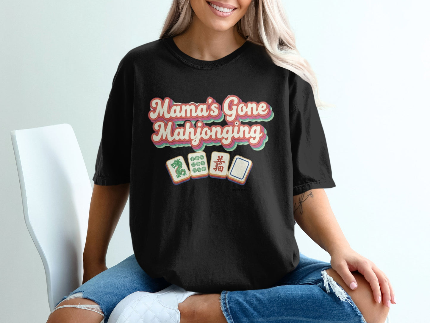 Black t-shirt with "Mama's Gone Mahjonging" and mahjong tiles graphic.