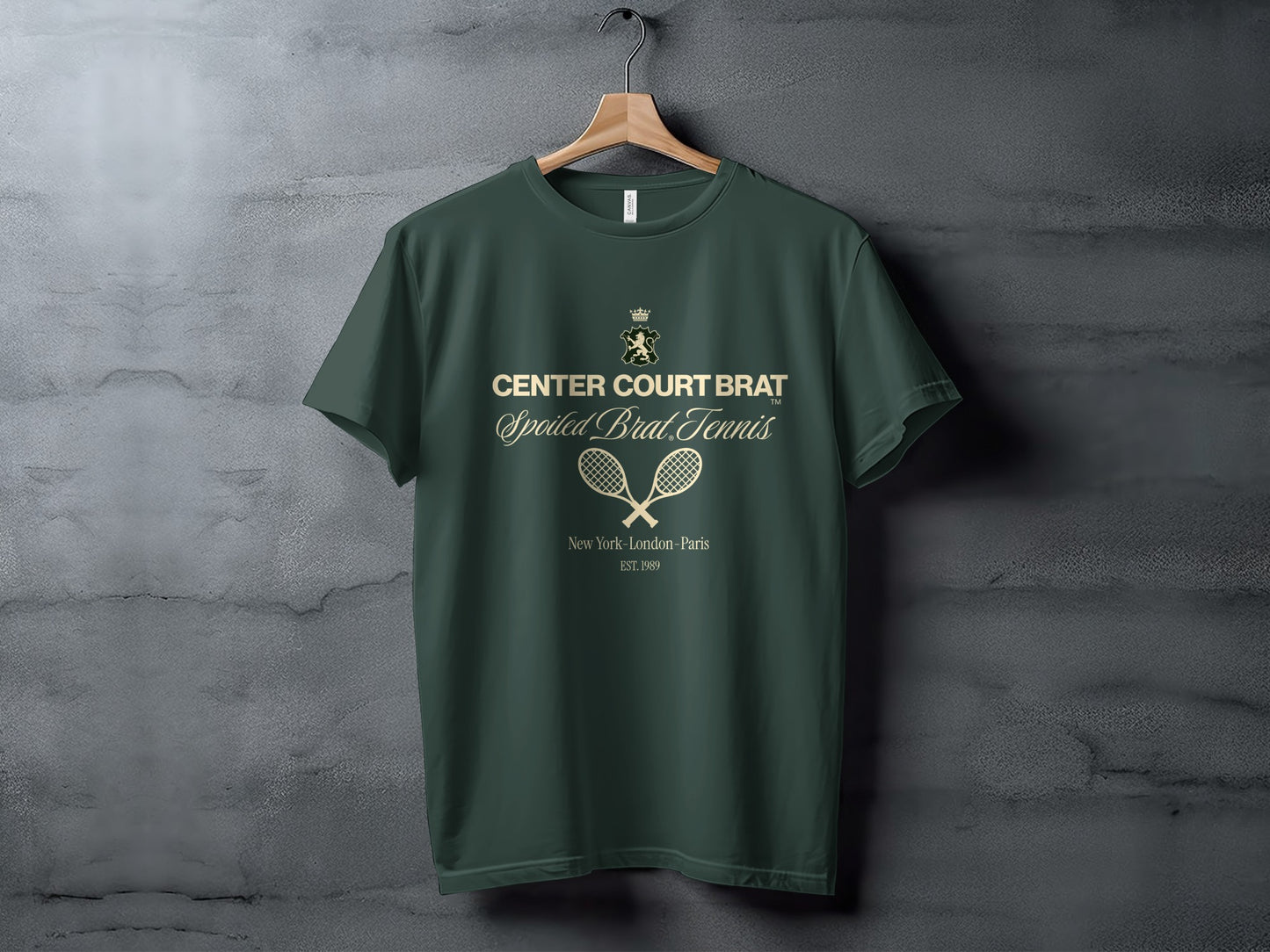 Green t-shirt with "CENTER COURT BRAT Spoiled Brat.Tennis" and tennis rackets.