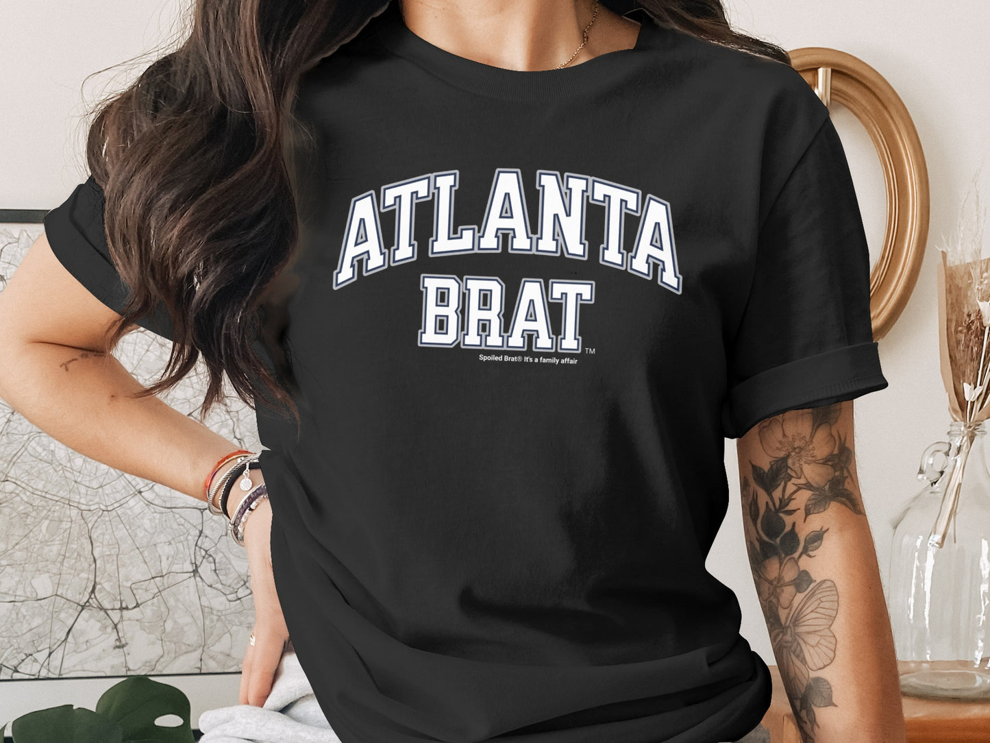 Black t-shirt with "ATLANTA BRAT" in white block letters.