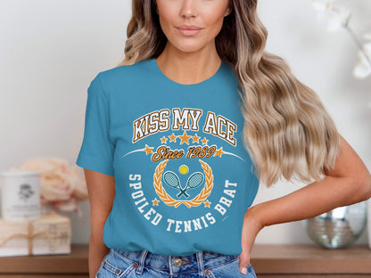 Blue t-shirt with "Kiss My Ace" and tennis graphic.
