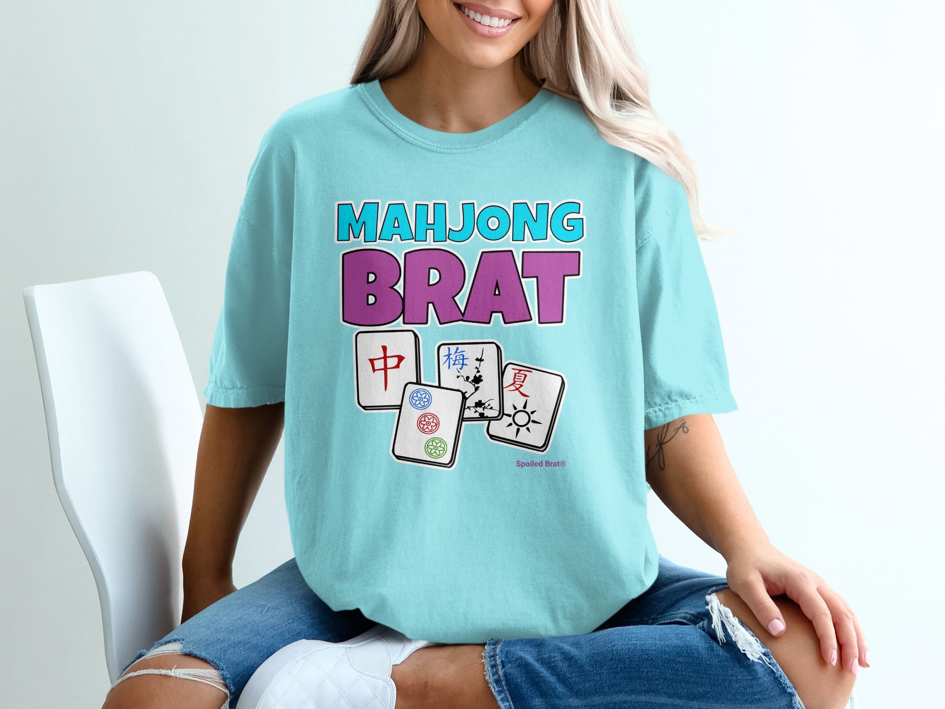 Blue t-shirt with "Mahjong Brat" text and Mahjong tiles.