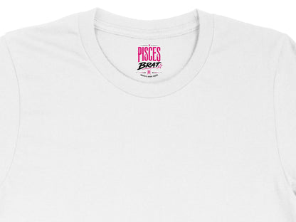 White t-shirt with "PISCES BRAT" and astrological symbols on the neck tag.