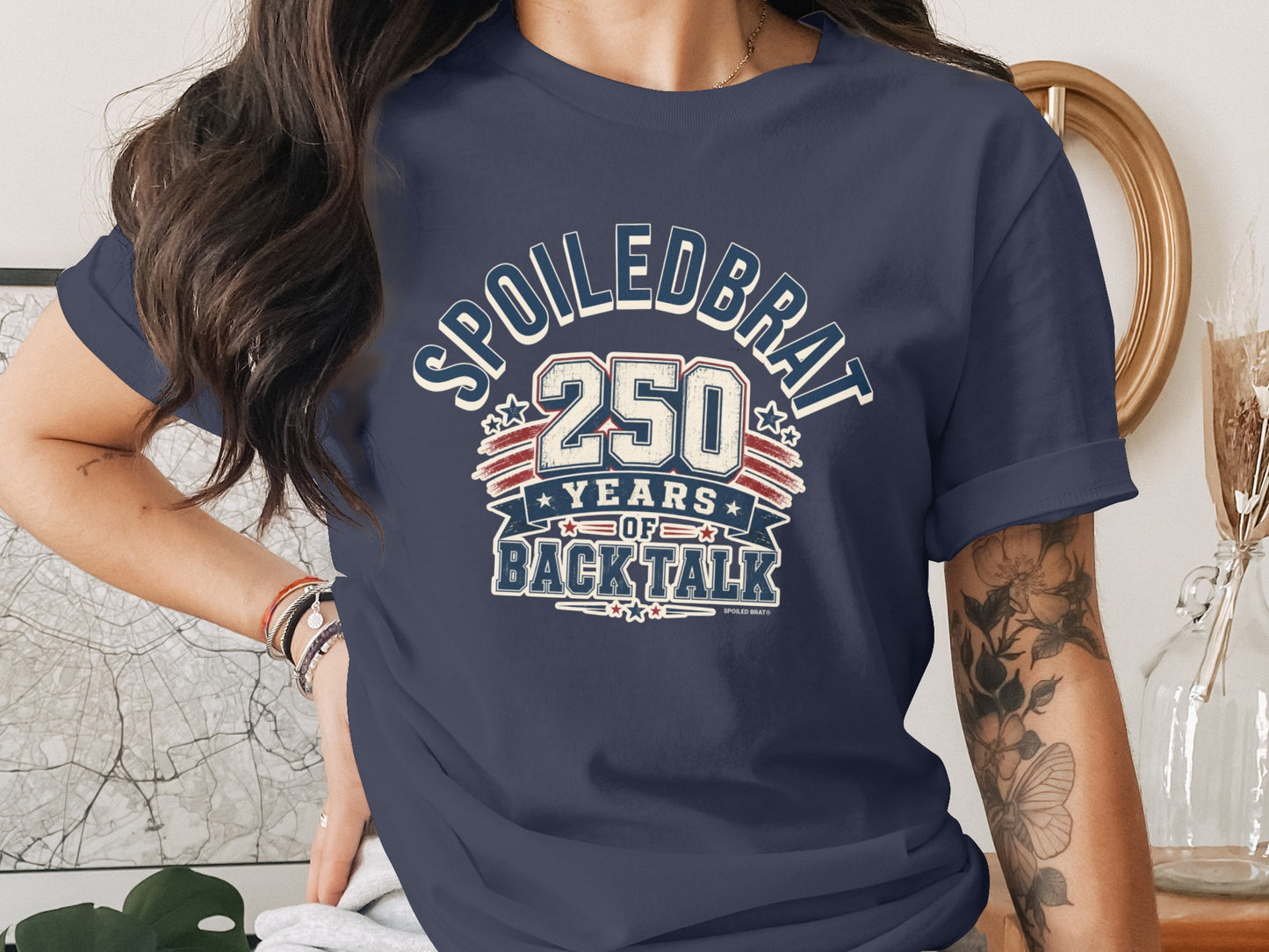 Navy t-shirt with "SPOILEDBRAT 250 YEARS OF BACKTALK" text and star accents.