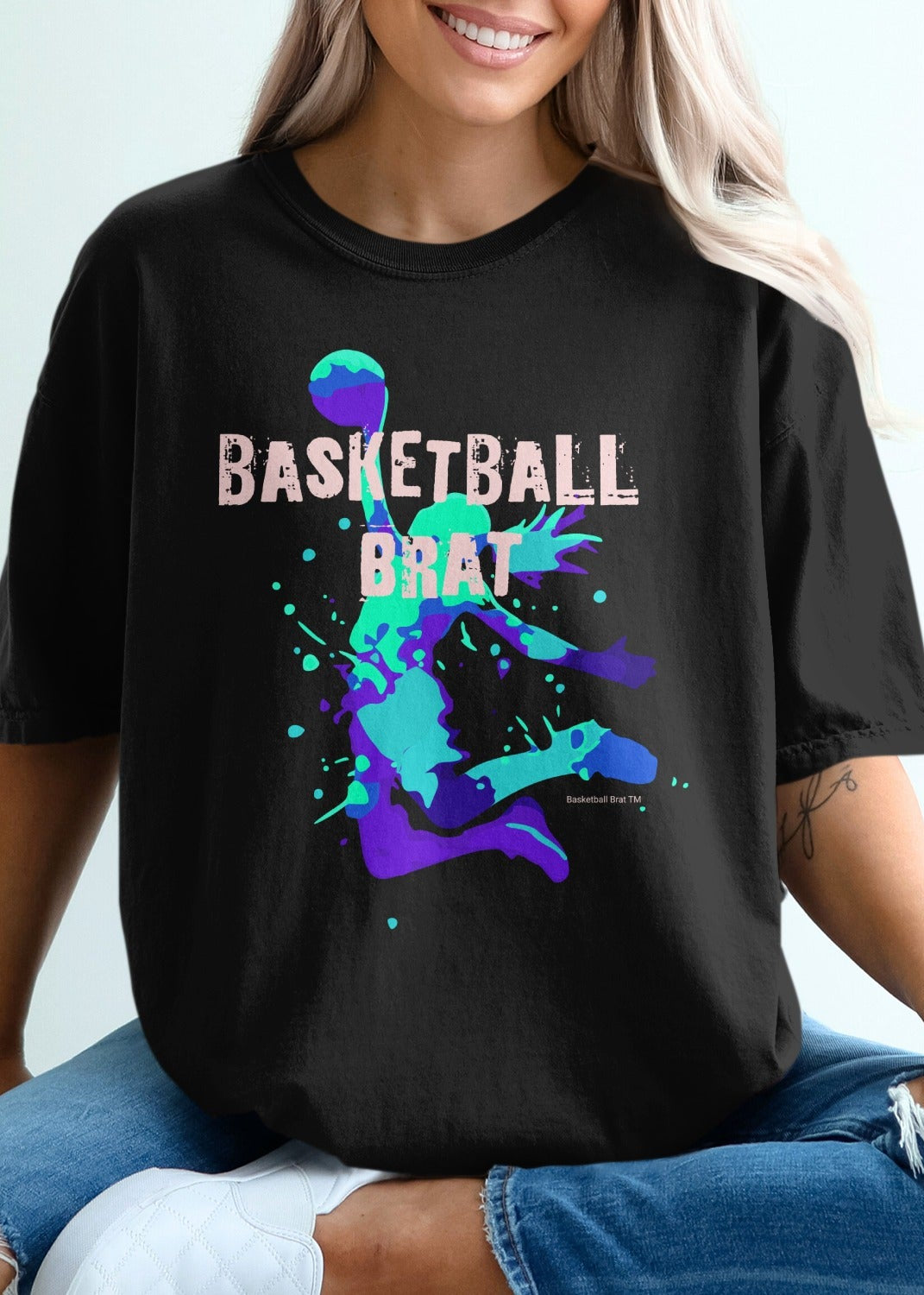 Black t-shirt with "BASKETBALL BRAT" text and abstract splash art.