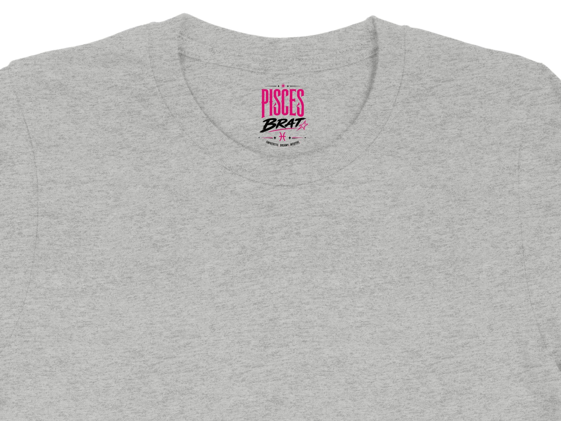 Grey t-shirt with "Pisces Brat" graphic and astrological symbol.