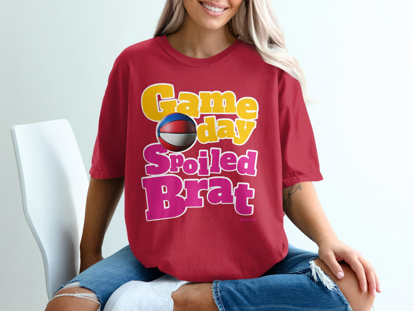 Red t-shirt with "Game day Spoiled Brat" text and basketball graphic.