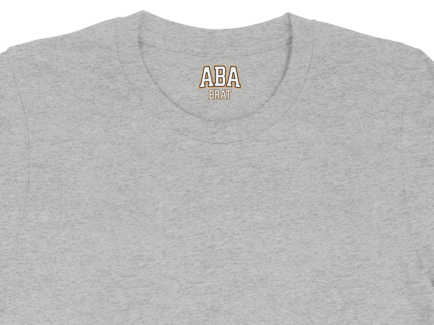 Grey t-shirt with "ABA BRAT" text on the collar.