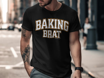 Black t-shirt with "BAKING BRAT" in white, yellow, and navy lettering.