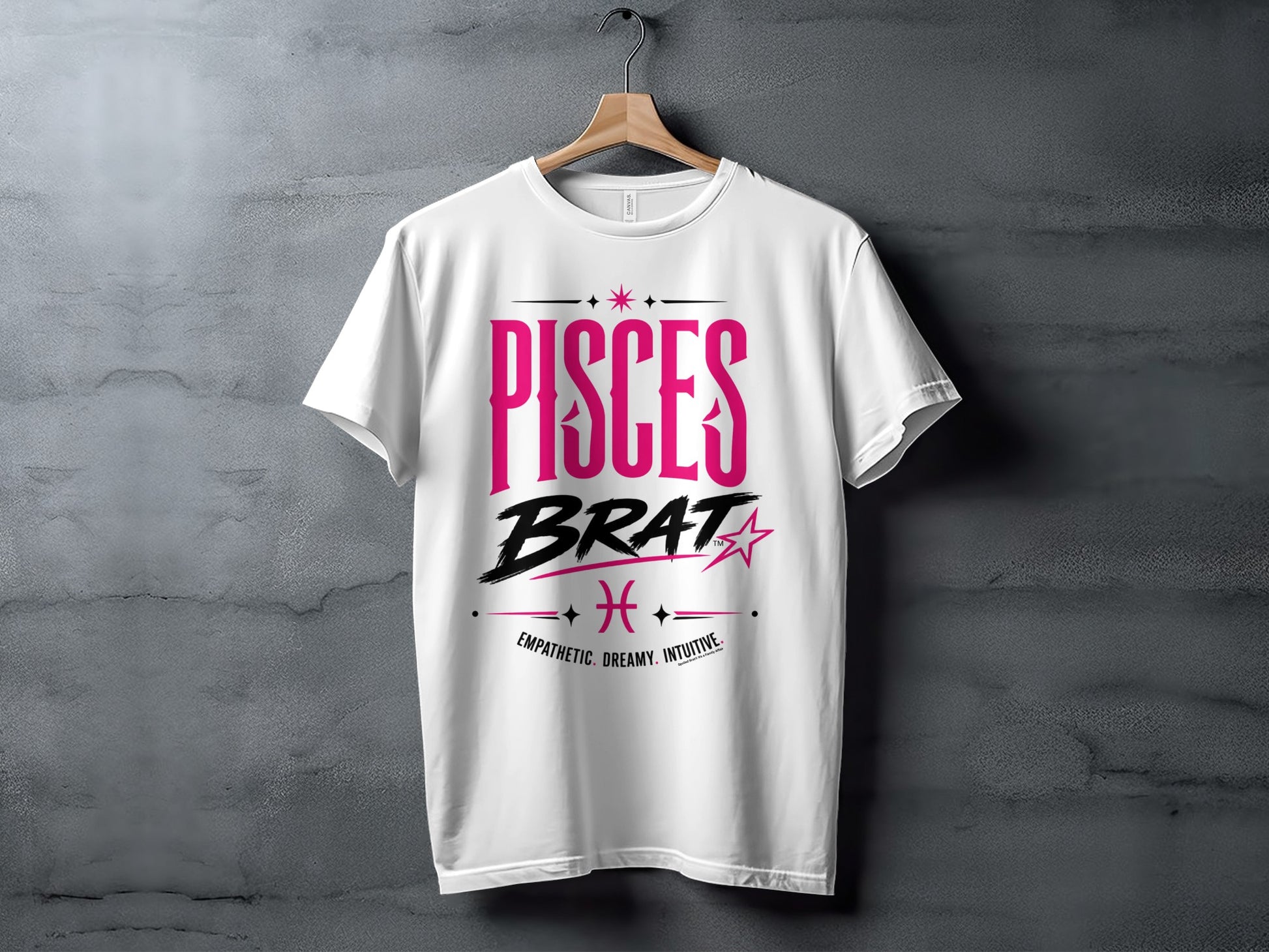 White t-shirt with "PISCES BRAT" in pink, Pisces symbol, and descriptive words.