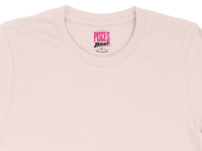 Pink t-shirt collar with "PISCES BRAT" and Pisces symbol.