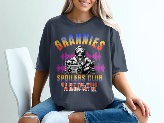 Dark t-shirt with "Grannies Spoilers Club" and skull DJ graphic.