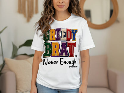 White t-shirt with colorful "GREEDY BRAT" text and "Never Enough" below.