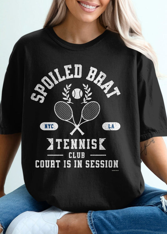 Black t-shirt with "Spoiled Brat Tennis Club" text and crossed rackets.