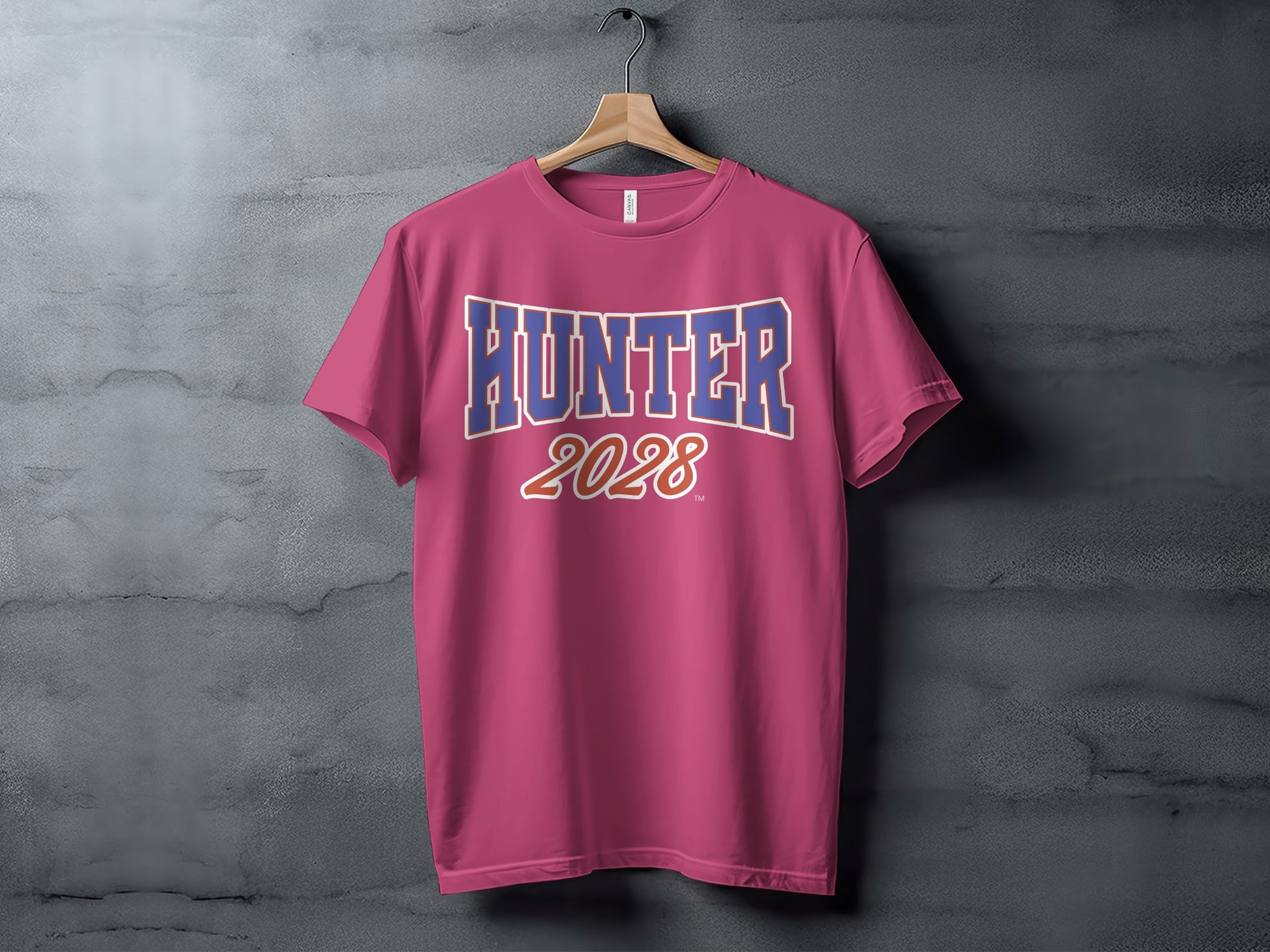 Pink t-shirt with text "HUNTER 2028" printed in blue and white.