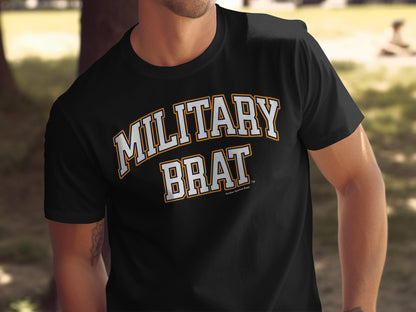 Black t-shirt with "MILITARY BRAT" in white and yellow collegiate lettering.