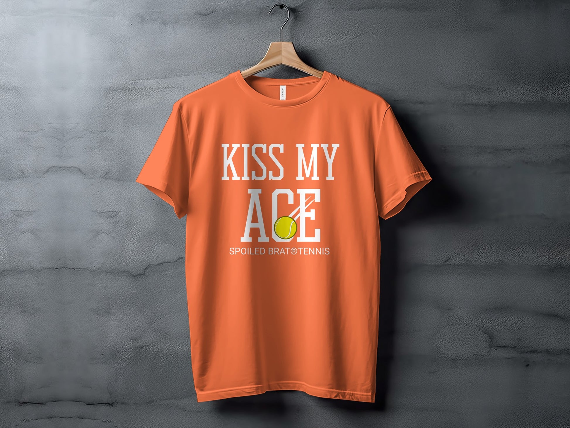 Orange t-shirt with "KISS MY ACE" and tennis ball graphic.