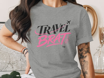 Grey t-shirt with "TRAVEL BRAT" text and airplane graphic