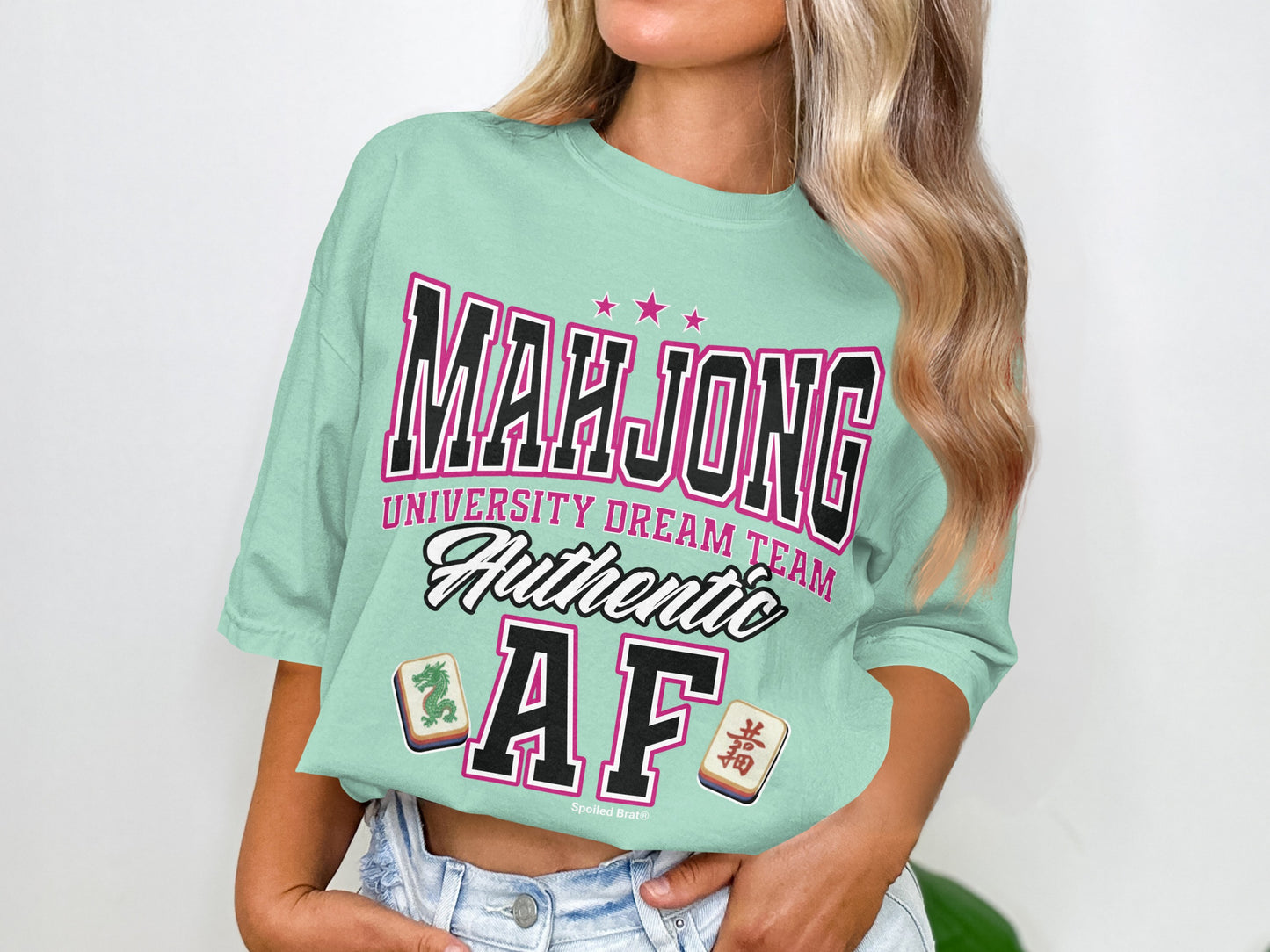 Light teal t-shirt with "Mahjong University Dream Team Authentic AF" text and mahjong tiles.