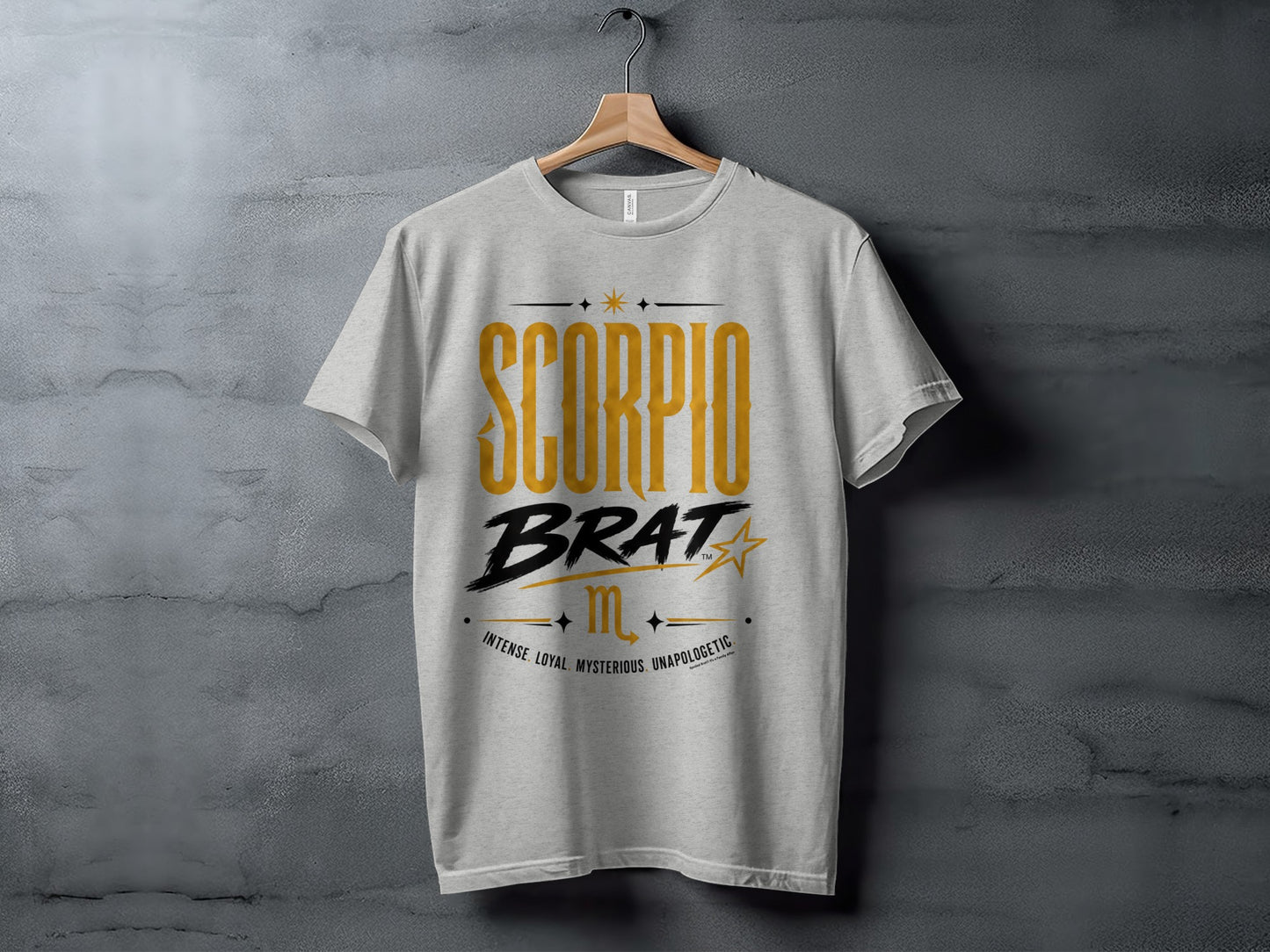 Grey t-shirt with "SCORPIO BRAT" and descriptive words.