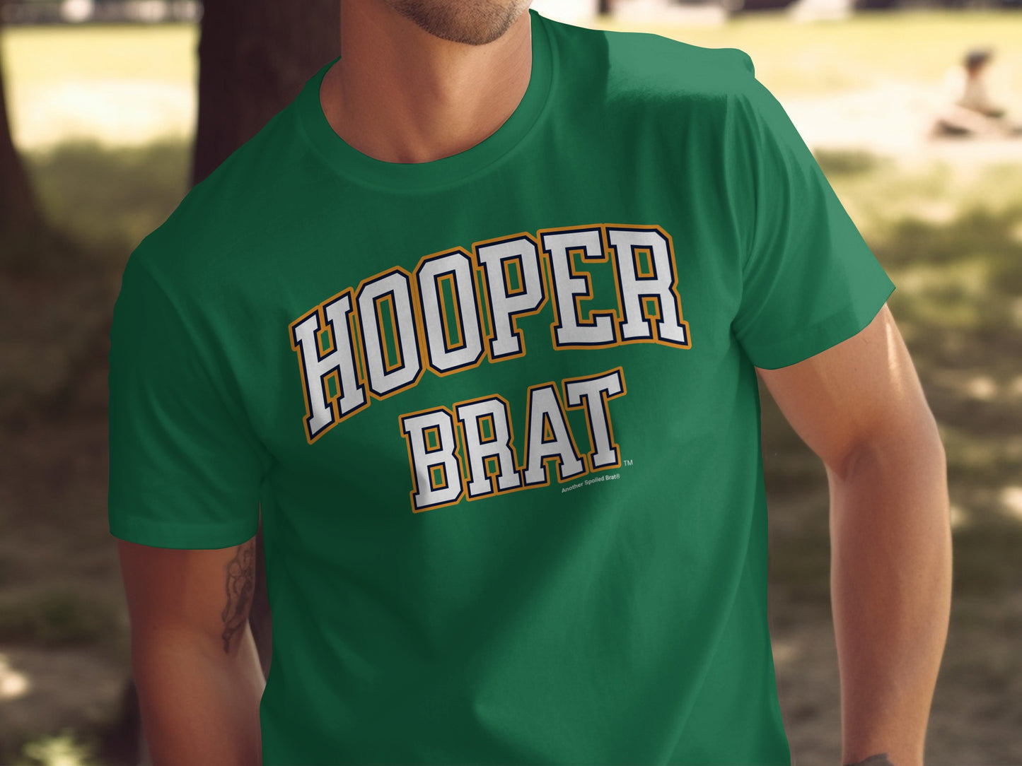 Green t-shirt with white and orange text reading "HOOPER BRAT" and "Another Spoiled Brat".