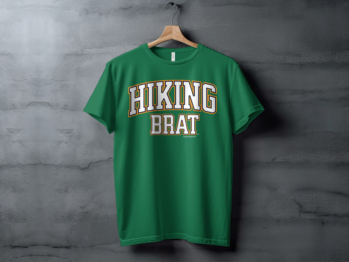 Green t-shirt with "HIKING BRAT" text and a smaller "Another Spoiled Brat®" text.