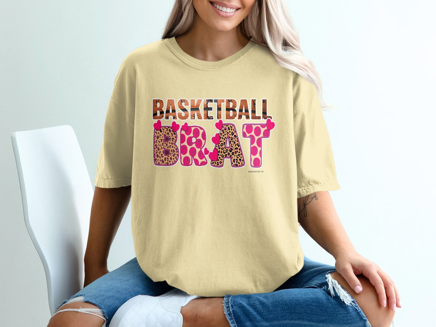 Yellow t-shirt with "BASKETBALL BRAT" in leopard print and pink hearts.