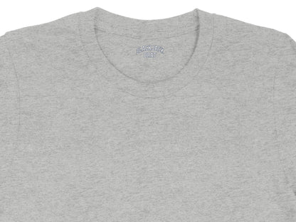 Grey t-shirt with "BLACKJACK BRAT" embroidered in blue letters on the collar.