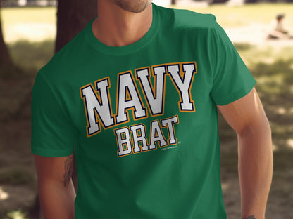 Green t-shirt with white "NAVY BRAT" text and an orange and navy outline.