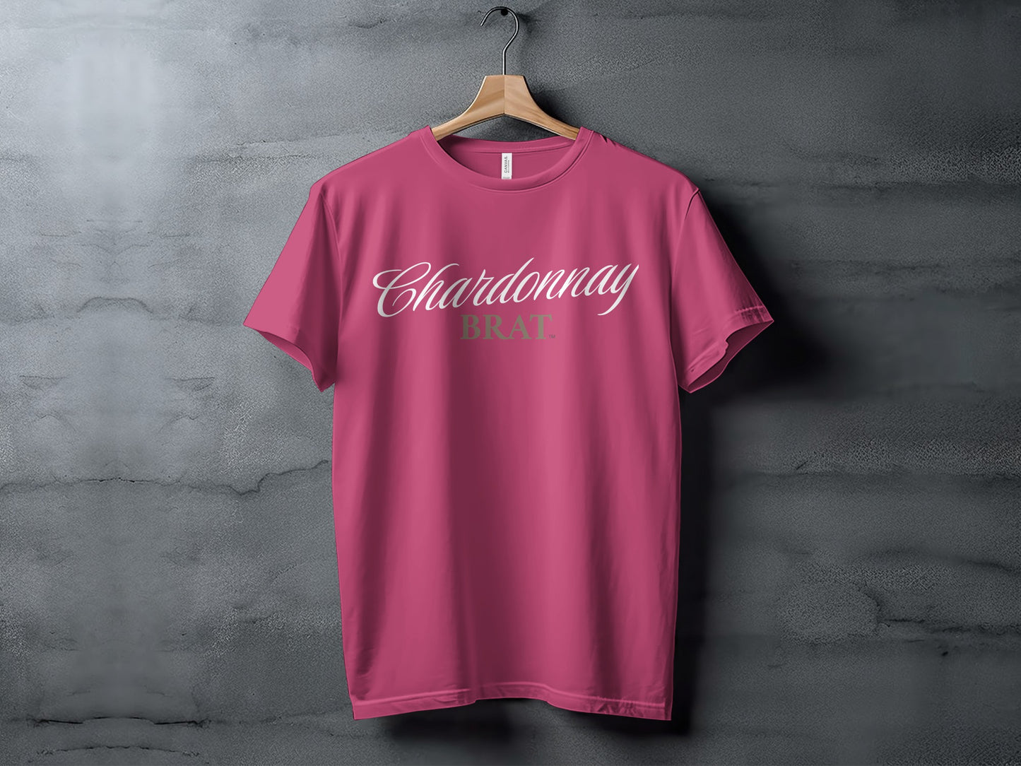 Pink t-shirt with "Chardonnay BRAT" text in white and green.