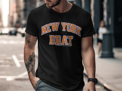 Black t-shirt with "NEW YORK BRAT" in orange and blue lettering.