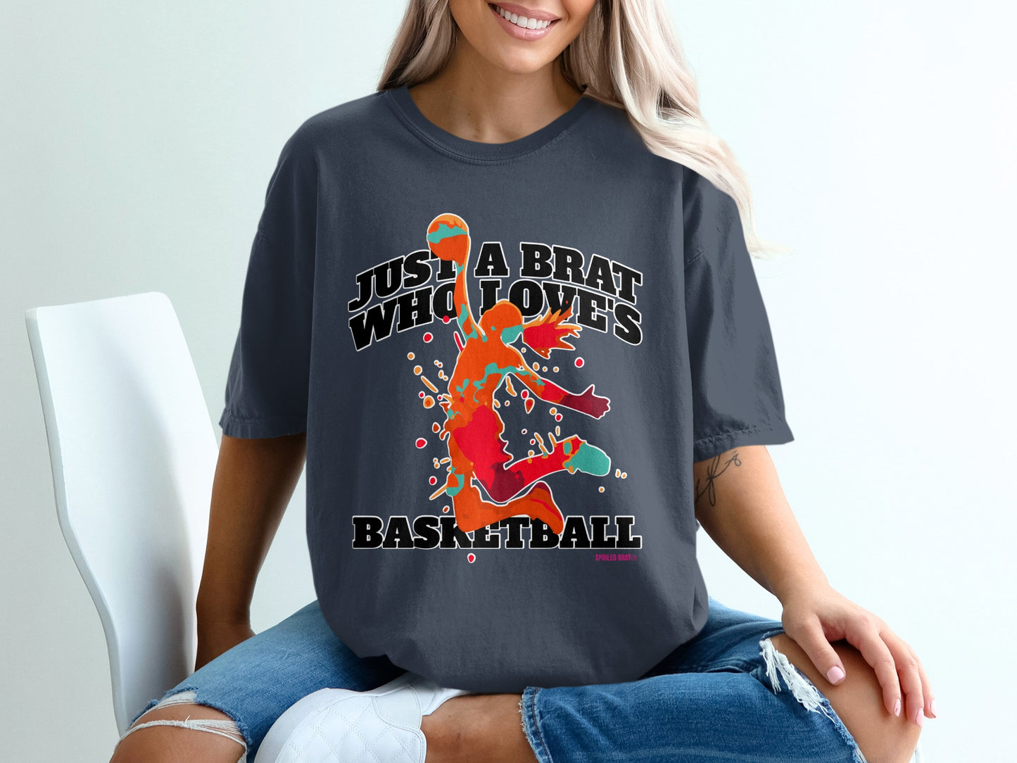 Dark t-shirt with a colorful basketball player graphic and text.