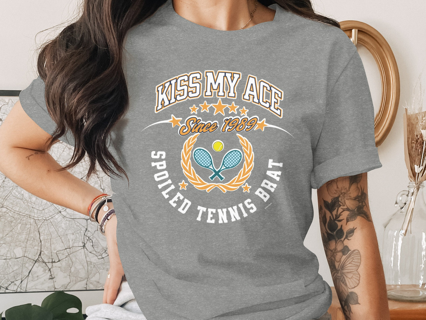 Grey t-shirt with "Kiss My Ace" and tennis racket graphic.