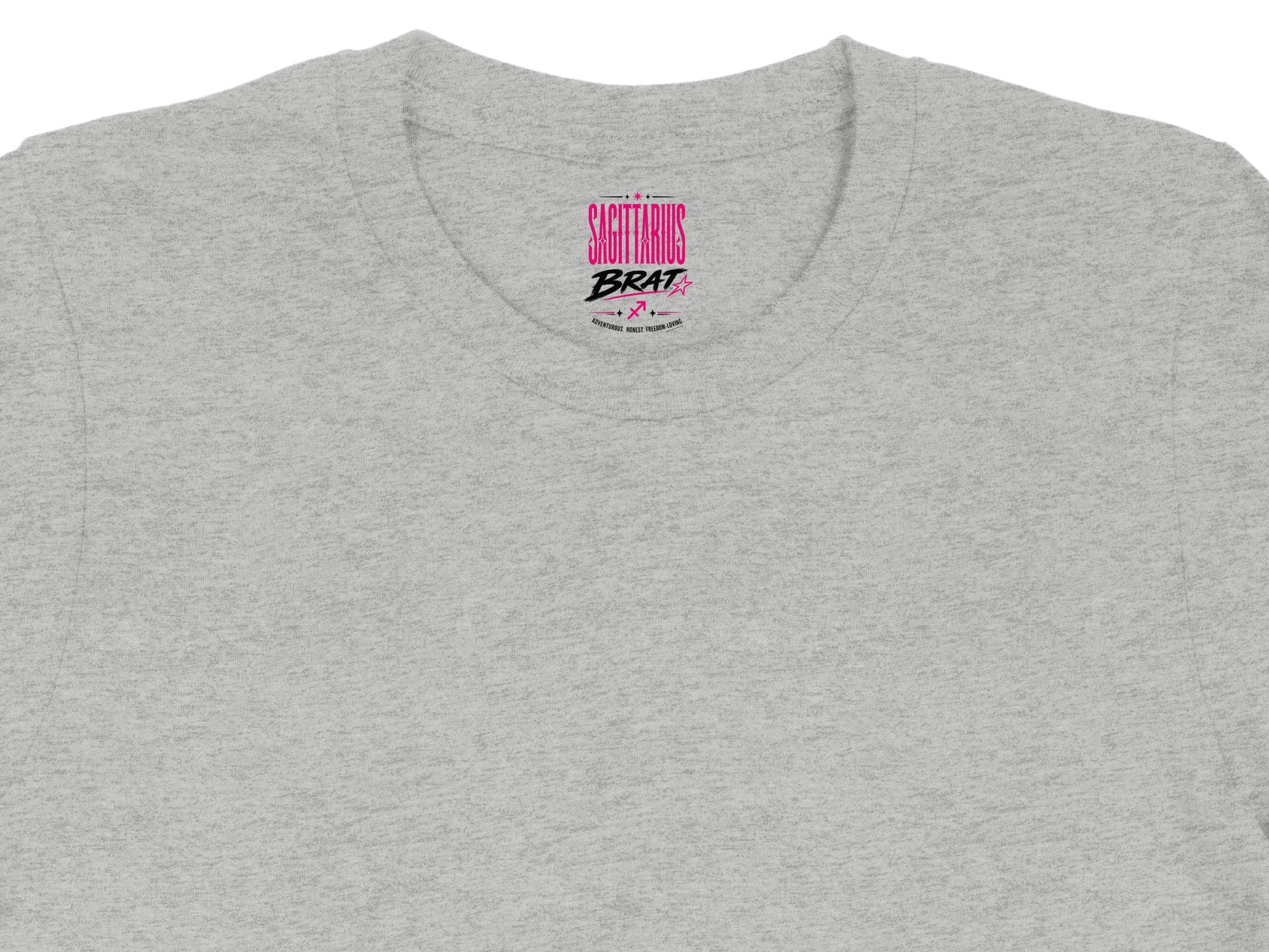 Grey crewneck t-shirt with "Sagittarius Brat" pink text and zodiac symbols.