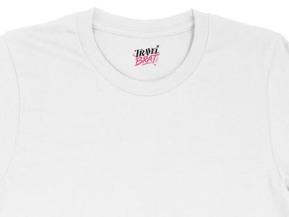 White t-shirt with "TRAVEL BRAT" logo on the neck label.