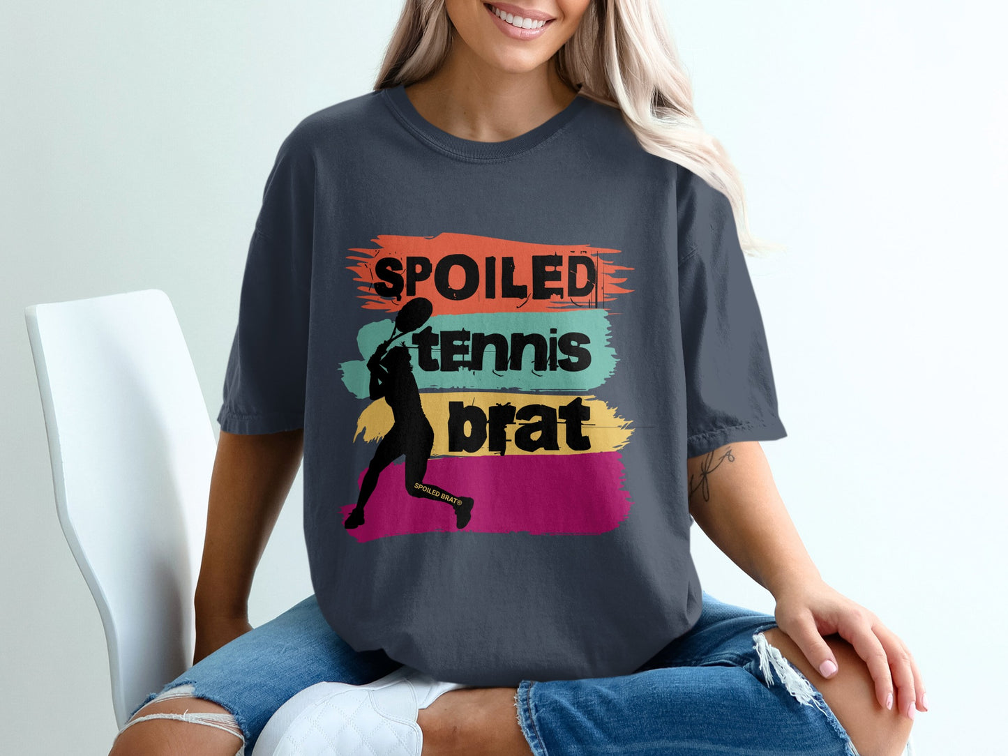 Dark grey t-shirt with "SPOILED tennis BRAT" text and silhouette of a tennis player.